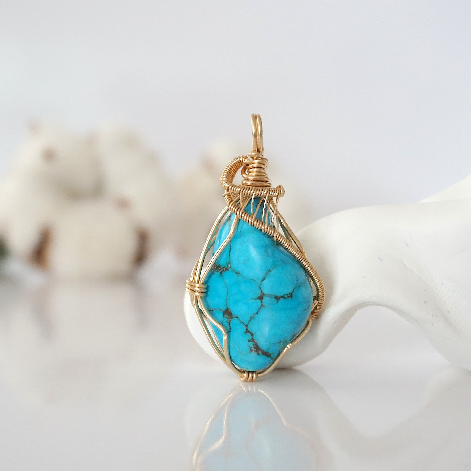 Detailed front view of raw turquoise pendant in 14k gold filled. Unique wire wrapped December birthstone jewelry by Designs by Nature Gems.