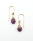 Detailed front view of ruby drop earrings, genuine faceted ruby with minimalist 14k gold filled wire wrapping, Designs by Nature Gems