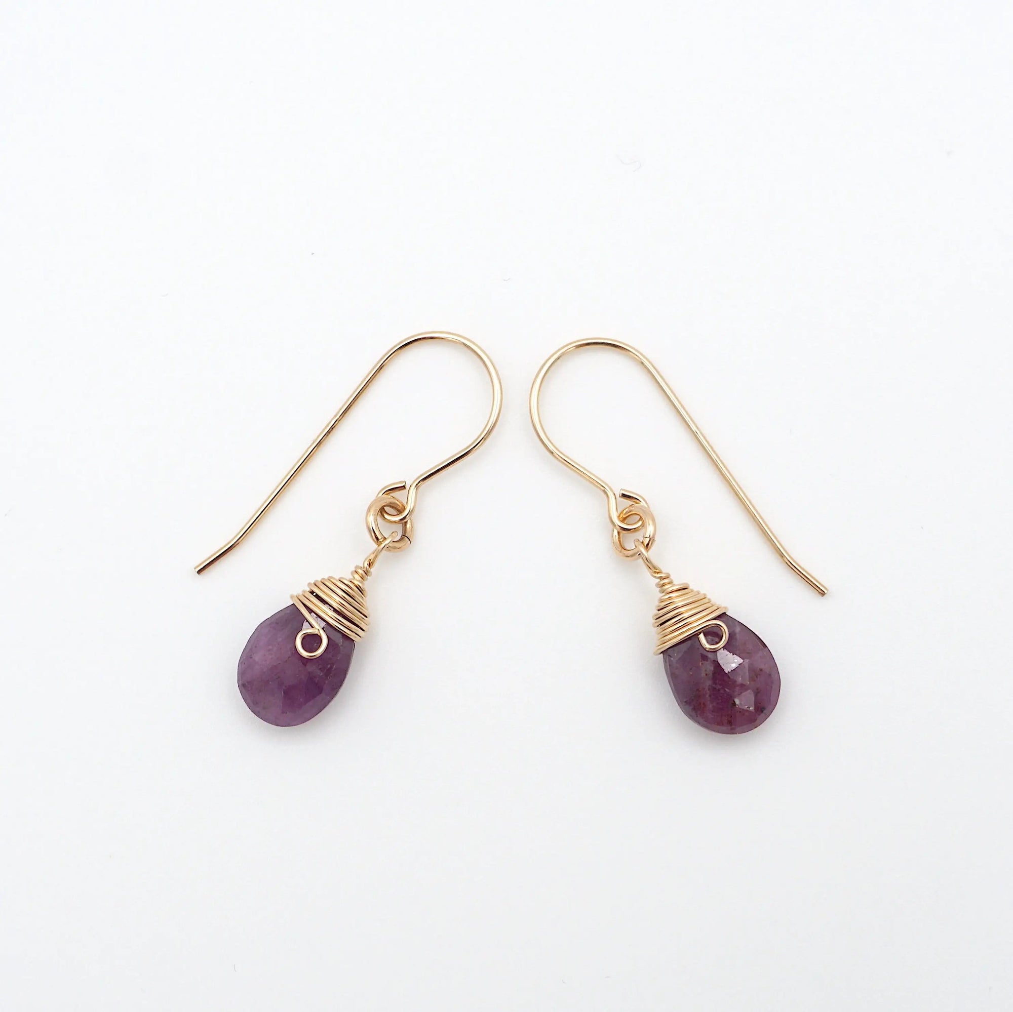 Side angle of ruby drop earrings, minimalist artisan wire wrapping, 14k gold filled
