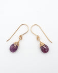 Side angle of ruby drop earrings, minimalist artisan wire wrapping, 14k gold filled