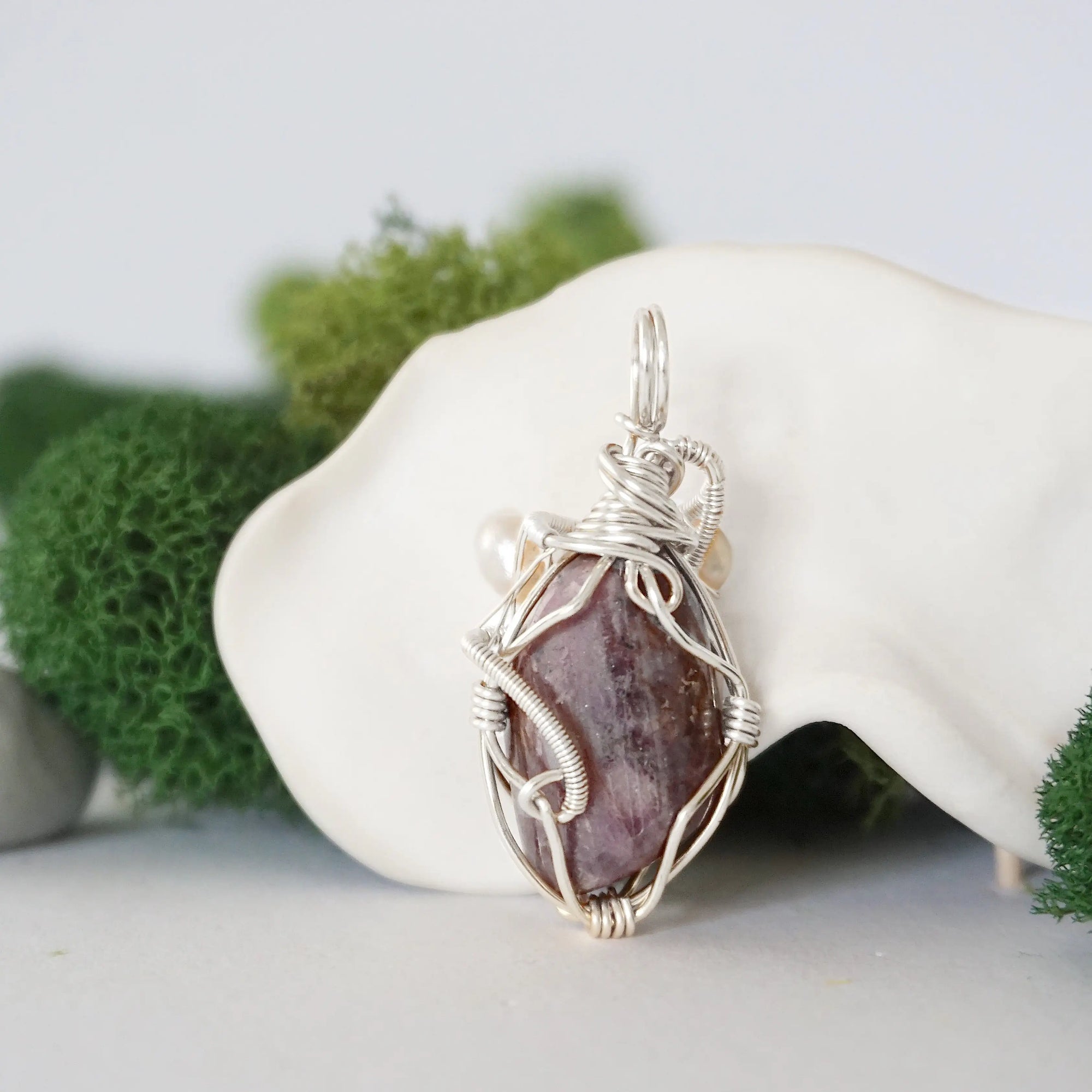 Back detail of silver wire wrapped ruby and freshwater pearl pendant necklace, handcrafted gemstone jewelry