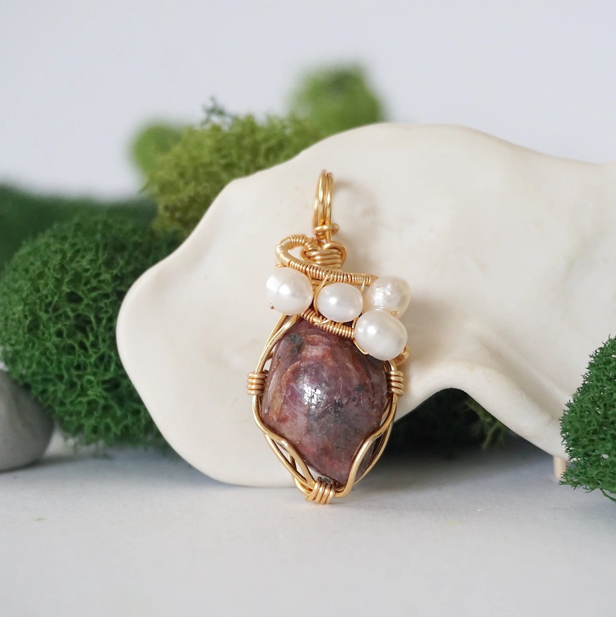 Detailed front angle of ruby and freshwater pearl pendant, gold wire wrapped, handcrafted gemstone jewelry