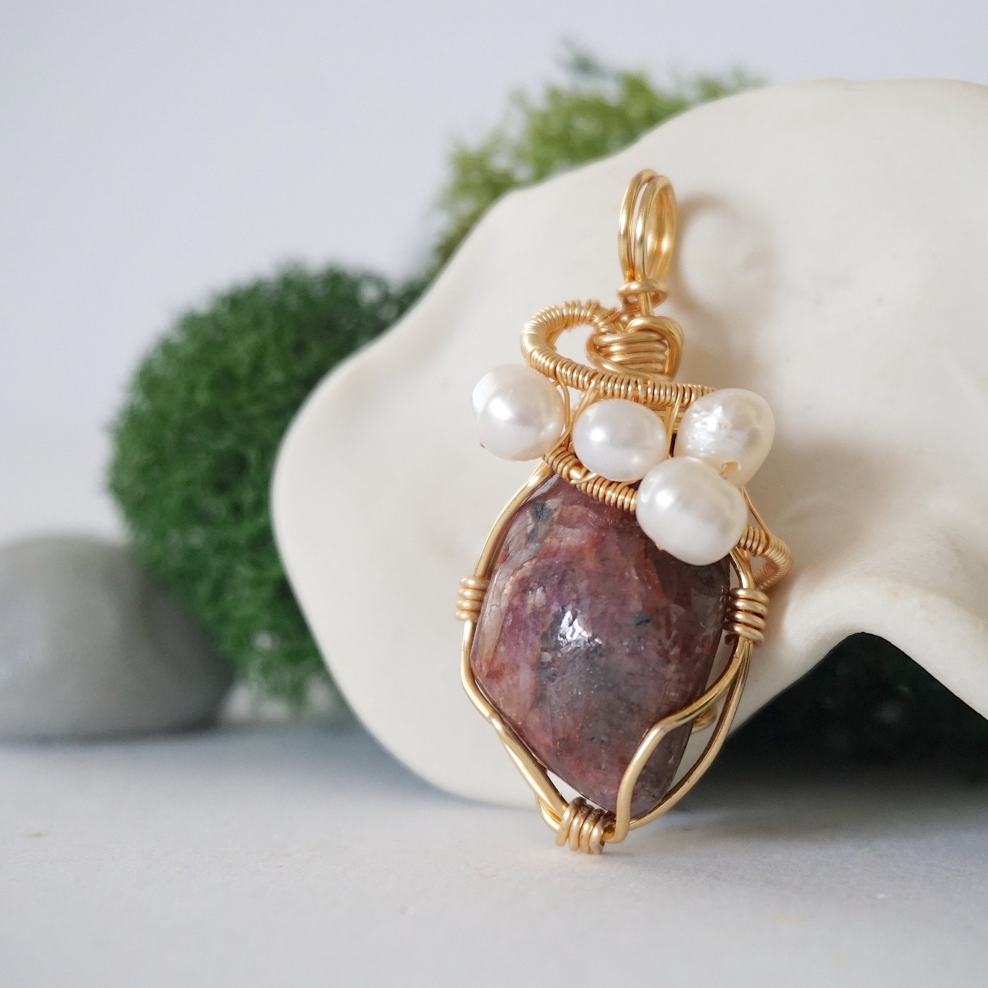 Side angle detail of ruby and freshwater pearl pendant, gold wire wrapped, ethical artisan necklace