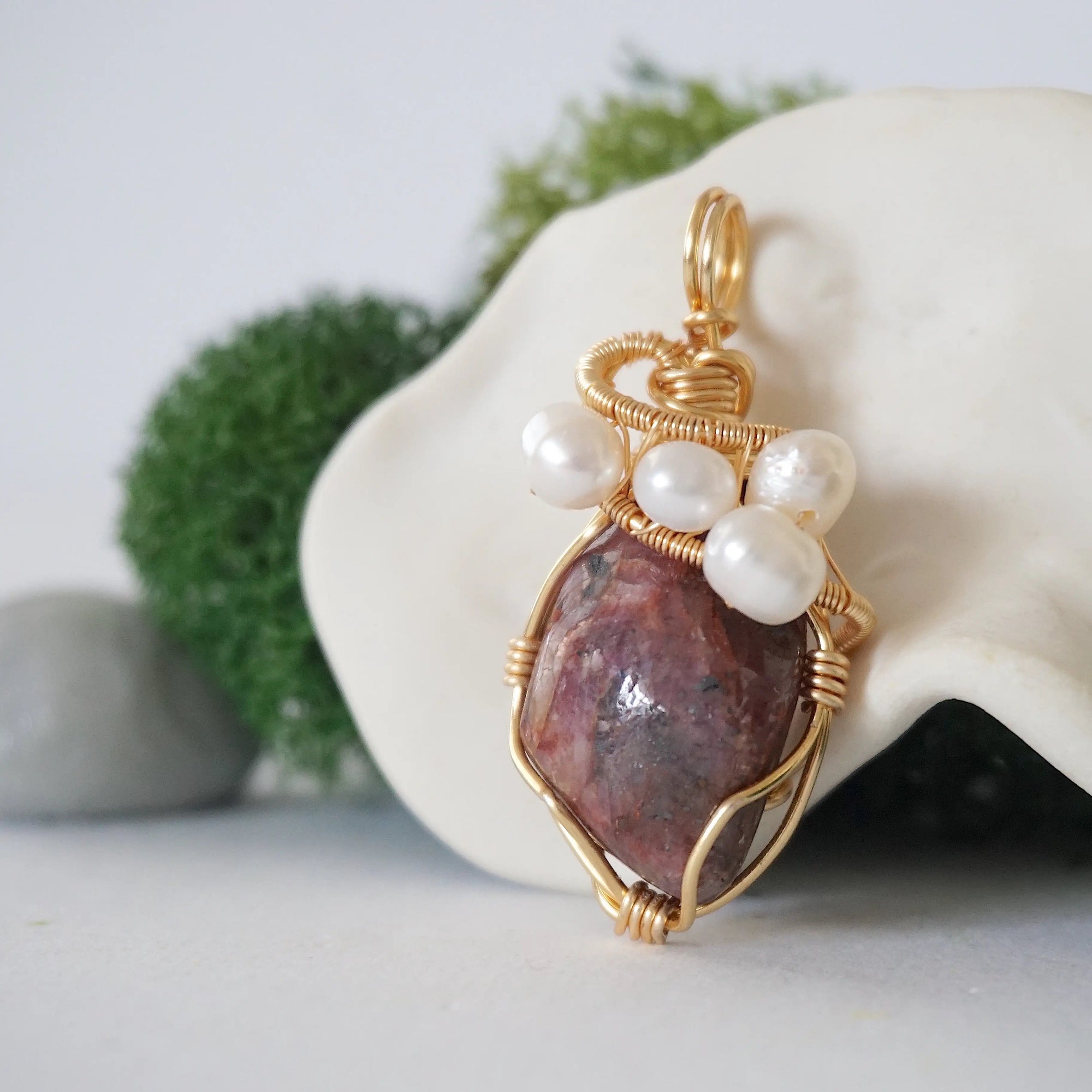 Side angle detail of ruby and freshwater pearl pendant, gold wire wrapped, ethical artisan necklace