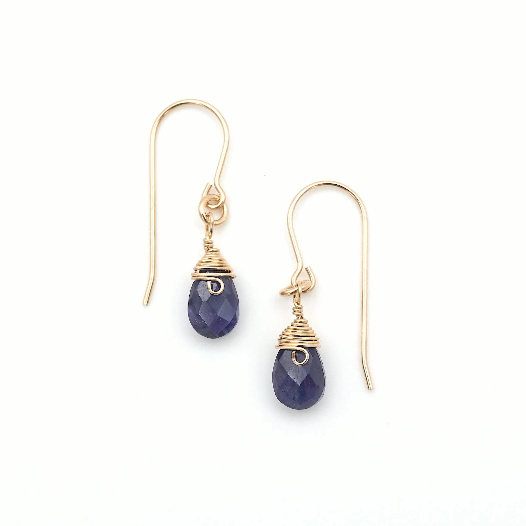 Detailed front view of sapphire drop earrings, genuine faceted sapphire with minimalist 14k gold filled wire wrapping, Designs by Nature Gems