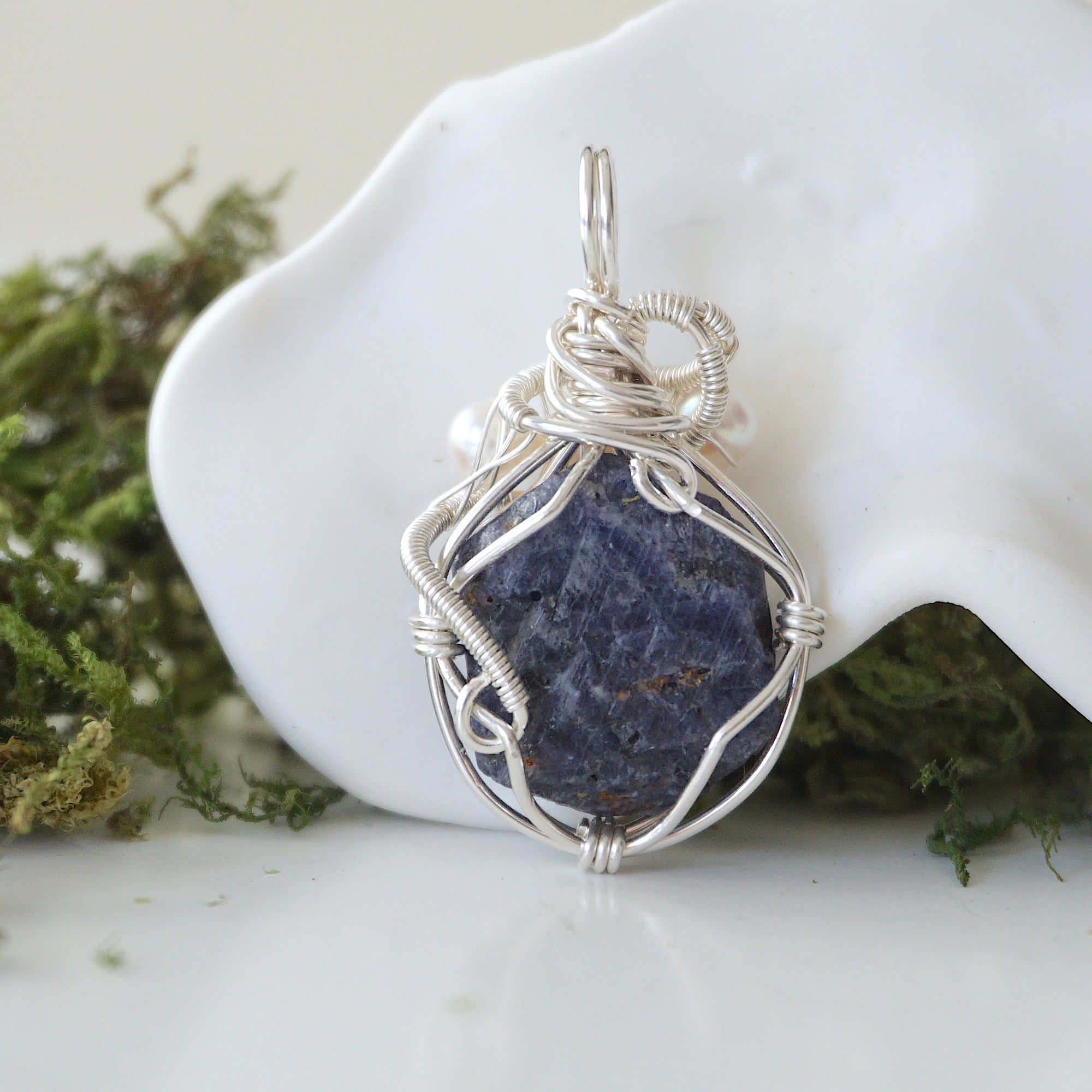 Back detail of silver wire wrapped sapphire and freshwater pearl pendant necklace, handcrafted gemstone jewelry