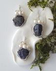 Three silver wire wrapped sapphire and freshwater pearl pendants showing natural stone variation, artisan jewelry for women
