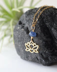 Left-angle detail of faceted sapphire and gold vermeil lotus necklace — handcrafted minimalist birthstone jewelry for women