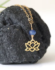 Right-angle detail of natural faceted sapphire and lotus necklace showing the gold vermeil charm and minimalist artisan design