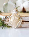 Back view of wire wrapped citrine necklace showing silver gold plated copper wire detail and artisan craftsmanship