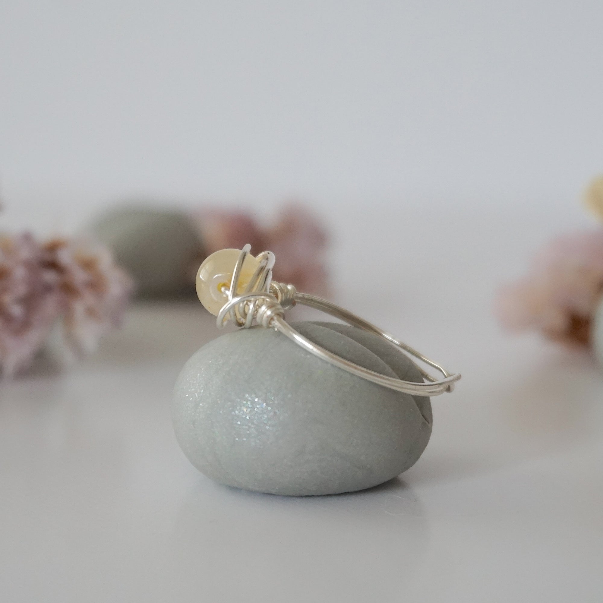 Side profile of raw silver citrine ring showing wire wrapping technique and crystal dimension - simple minimalist handmade crystal ring detail view