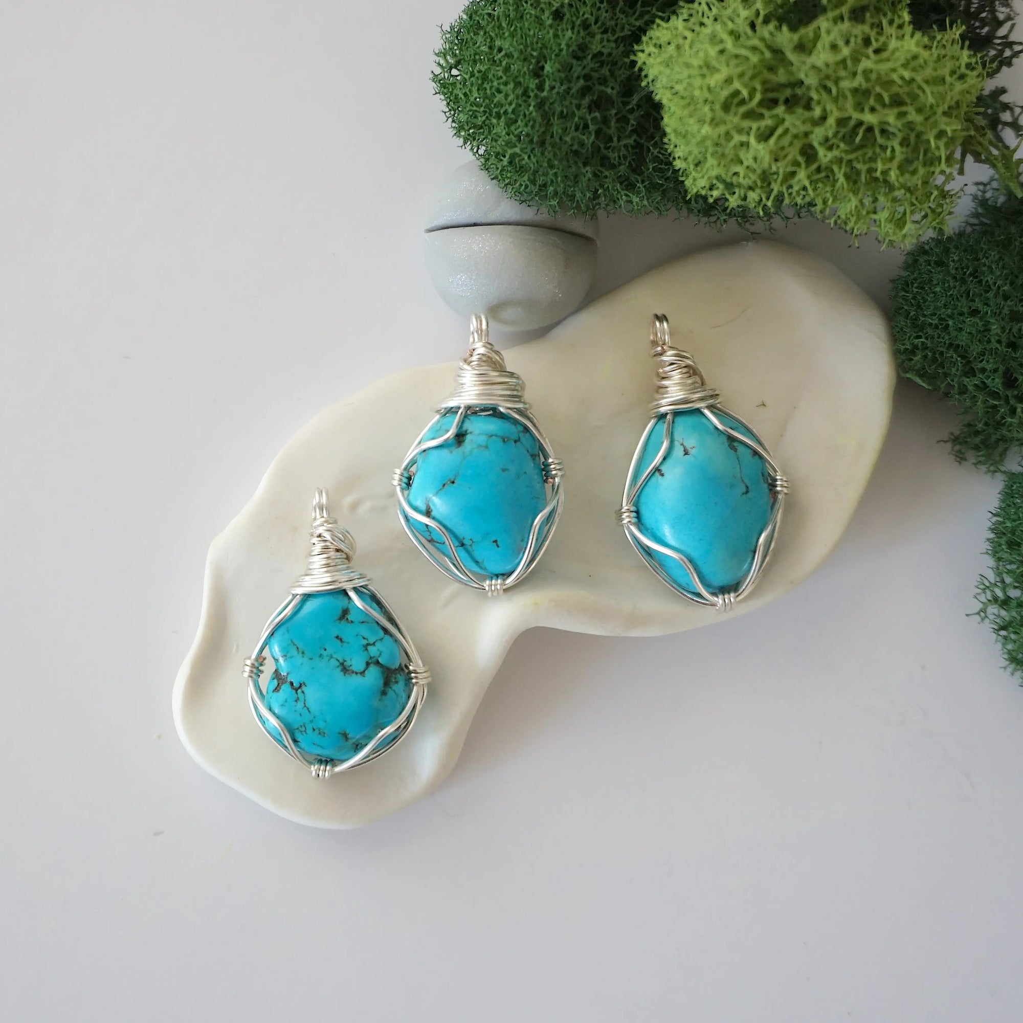 Three simple raw turquoise necklace variations showing natural stone color differences, minimalist wire wrapped