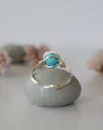 Back view of simple turquoise ring in silver plated copper showing handmade wire wrapping detail and craftsmanship quality