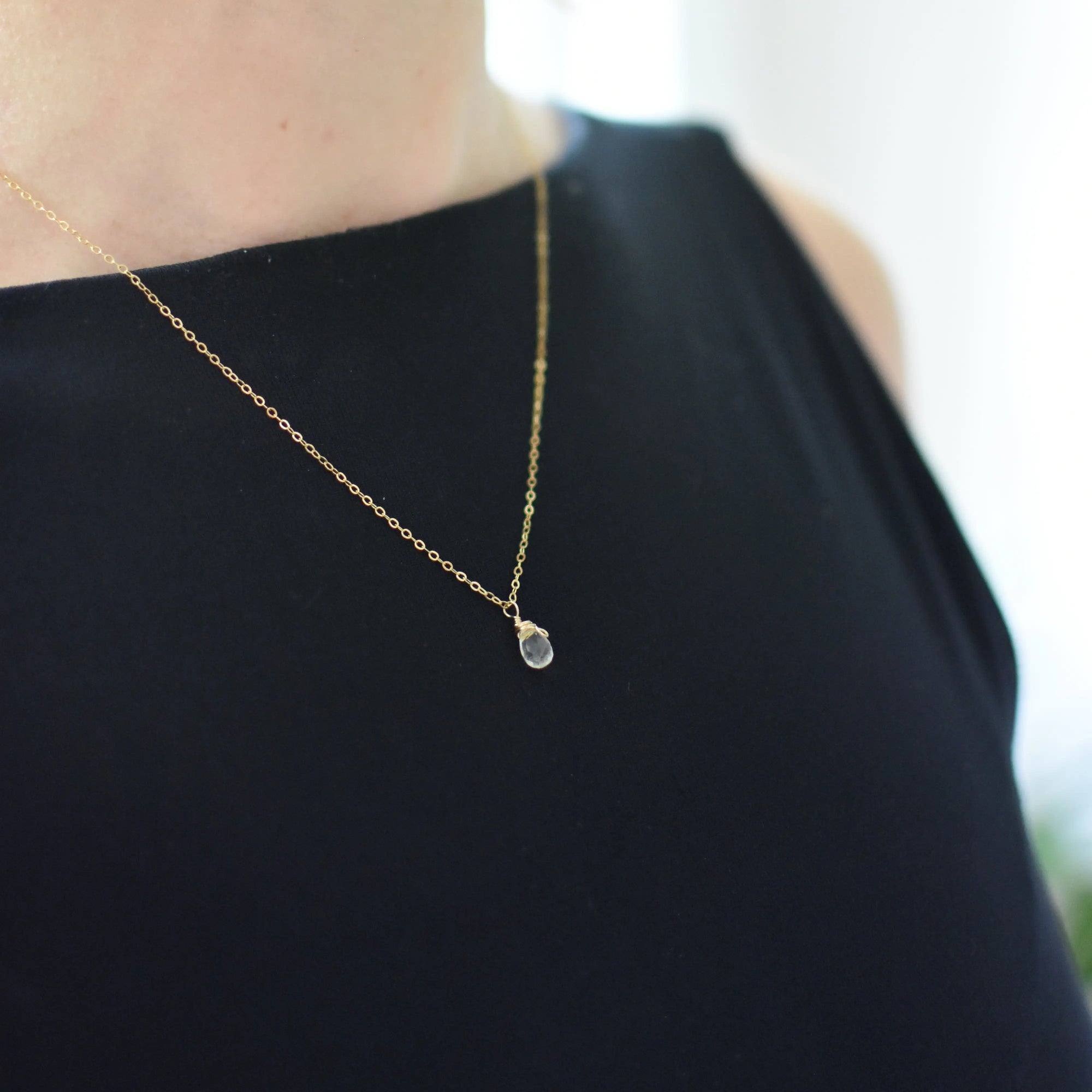 Woman wearing small delicate citrine necklace 14k gold filled minimalist crystal pendant jewelry
