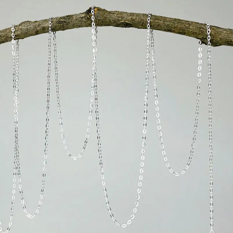 Detailed view of sterling silver chain used for Herkimer diamond and lotus necklace.