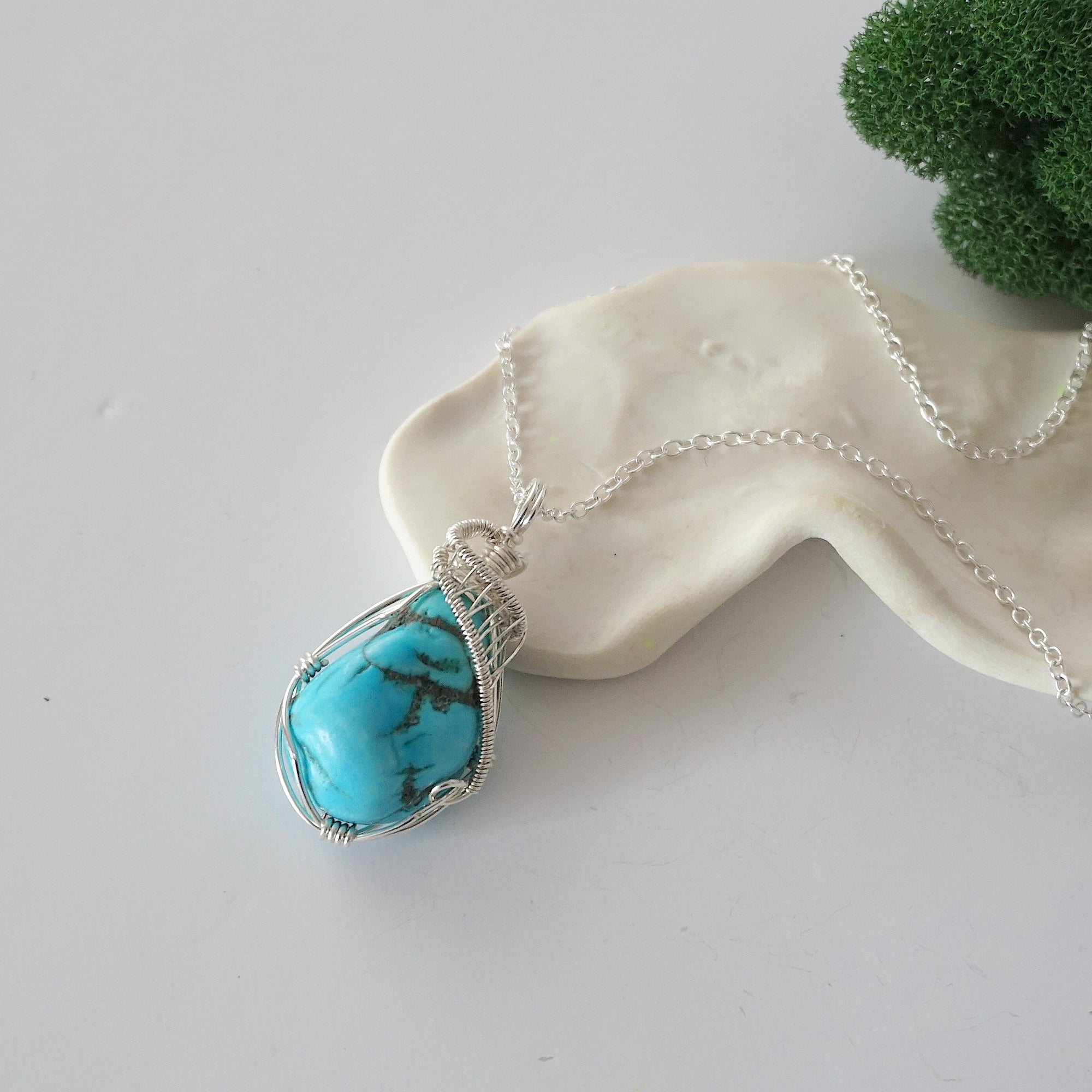 Sterling silver raw turquoise necklace for women with 925 silver chain, handmade wire wrapped crystal pendant flat lay