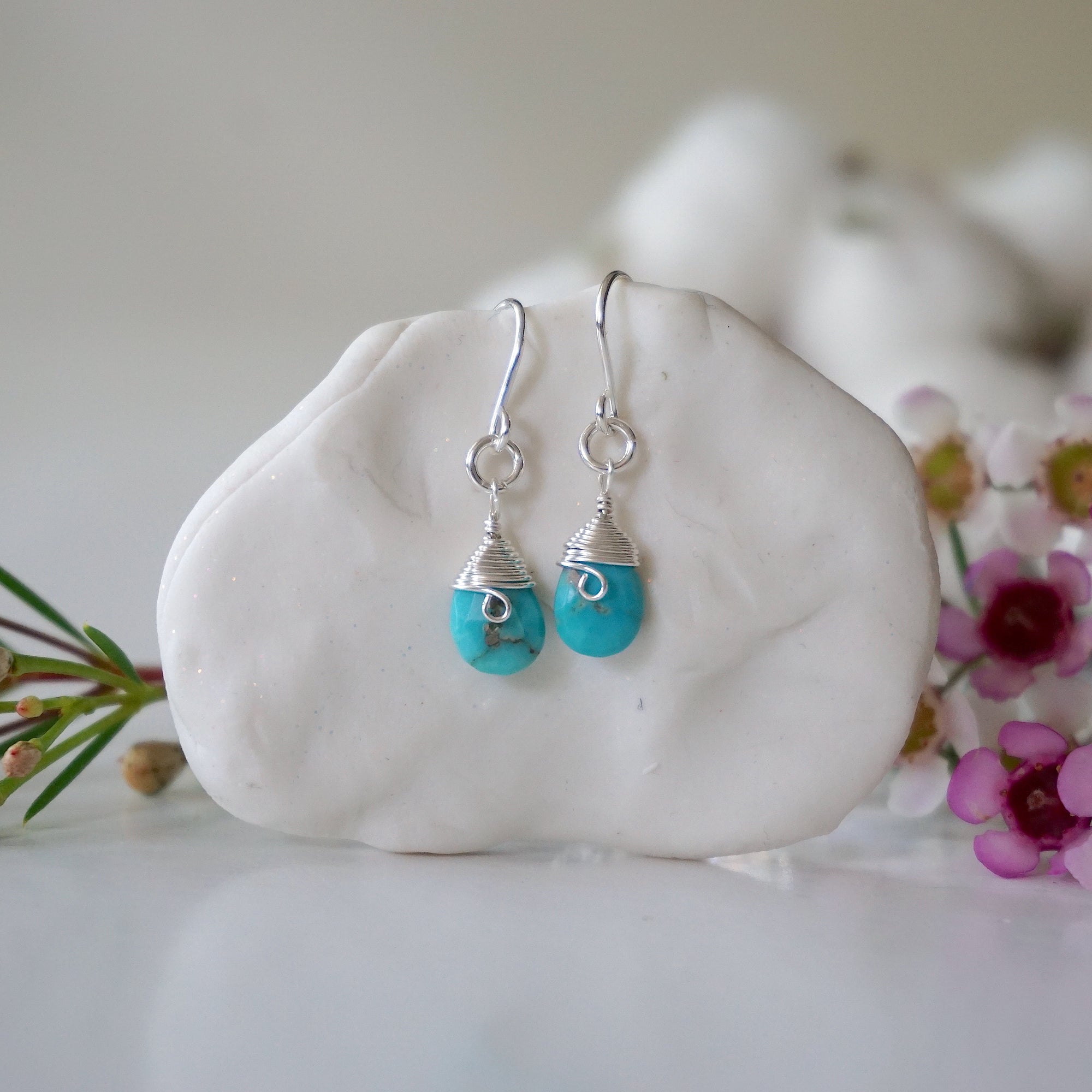 Sterling silver turquoise dangle drop earrings handmade wire wrapped front view natural faceted crystal December birthstone