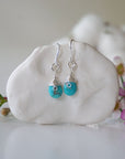 Sterling silver turquoise dangle drop earrings handmade wire wrapped front view natural faceted crystal December birthstone
