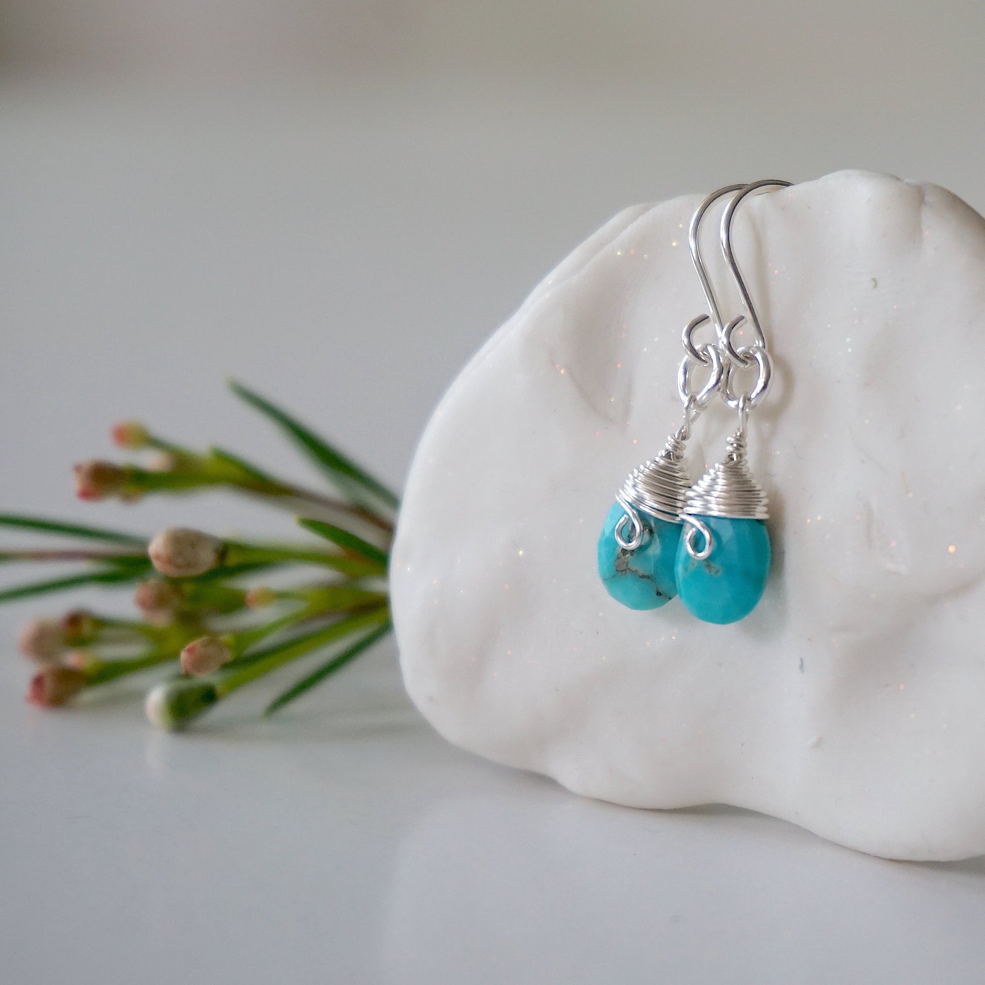 Sterling silver turquoise earrings left side detail natural faceted stone wire wrapped handmade 925 silver hypoallergenic