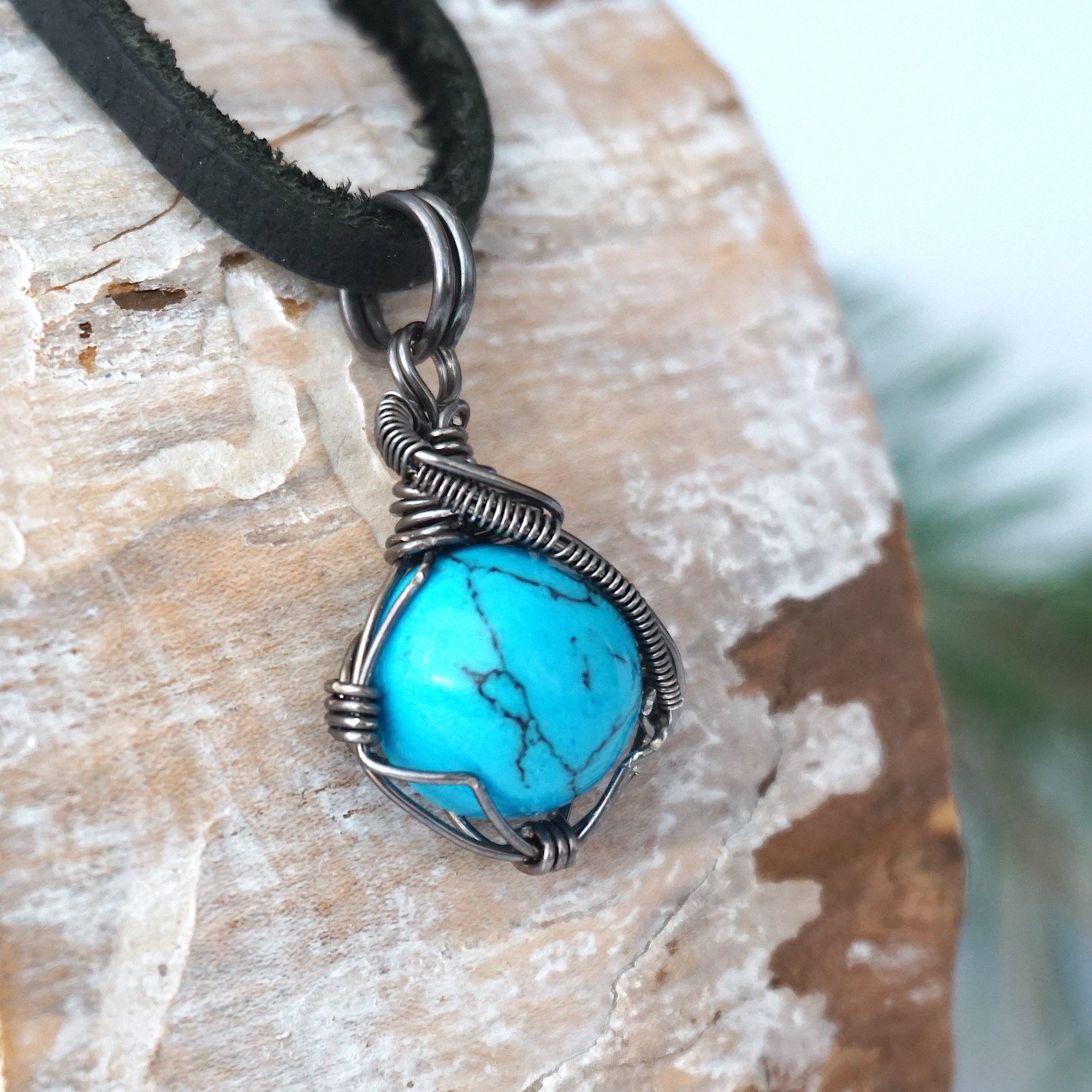 Sterling silver wire wrapped turquoise necklace for men side detail view black leather