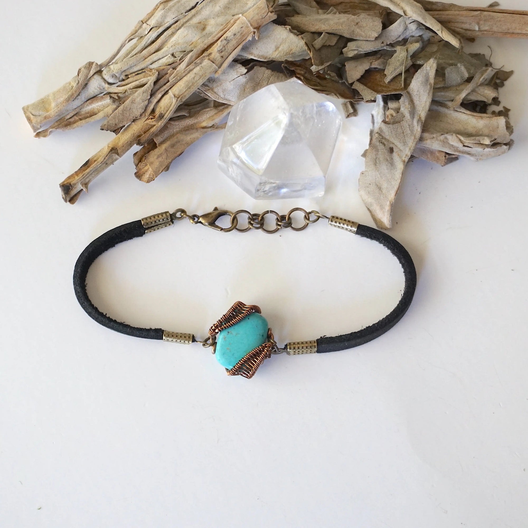 Top view of natural turquoise bracelet with antique bronze wire and genuine leather strap, full bracelet layout, December birthstone