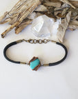 Top view of natural turquoise bracelet with antique bronze wire and genuine leather strap, full bracelet layout, December birthstone