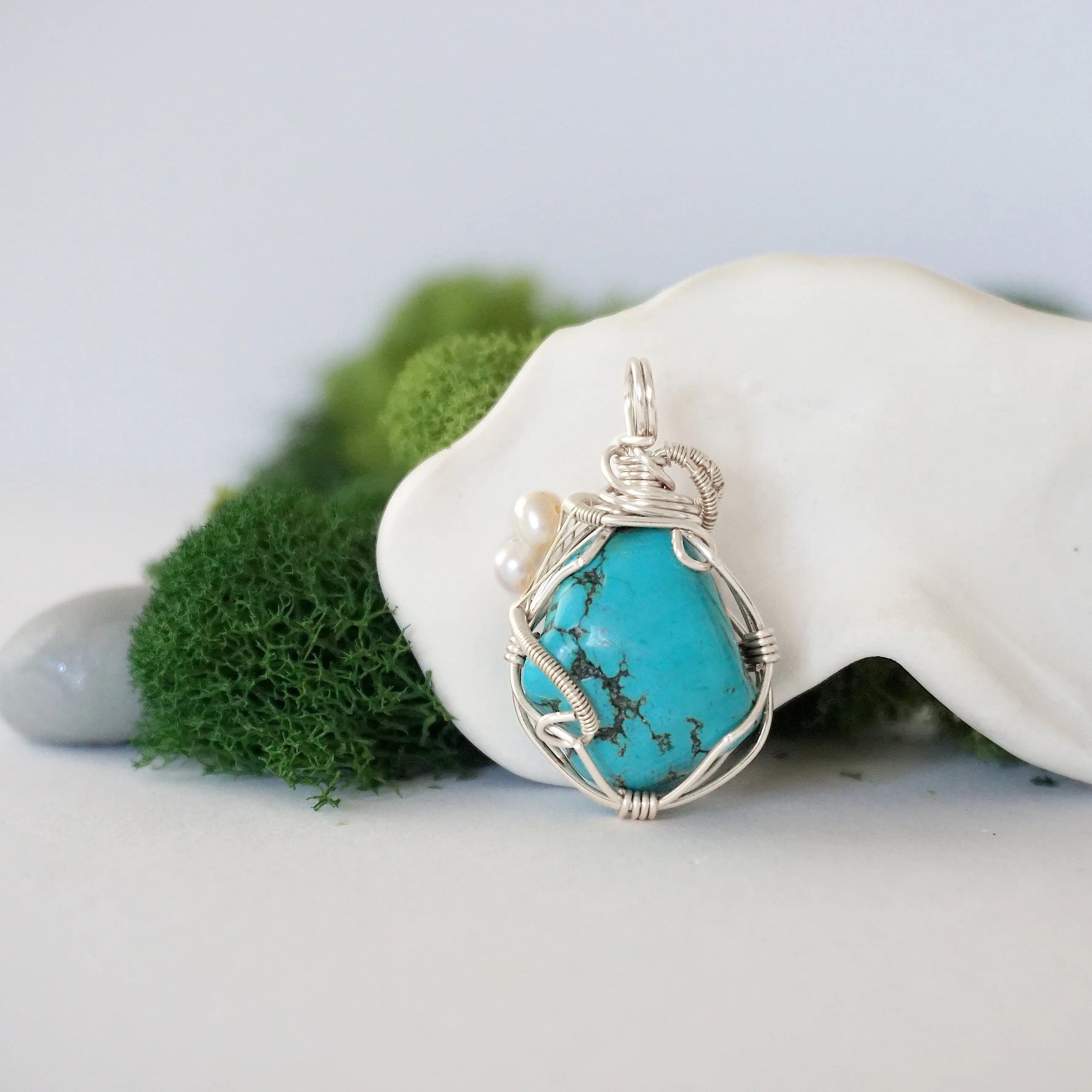 Back detail of silver wire wrapped turquoise and freshwater pearl pendant necklace, handcrafted gemstone jewelry