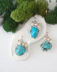 Three silver wire wrapped turquoise and freshwater pearl pendants showing natural stone variation, artisan jewelry for women