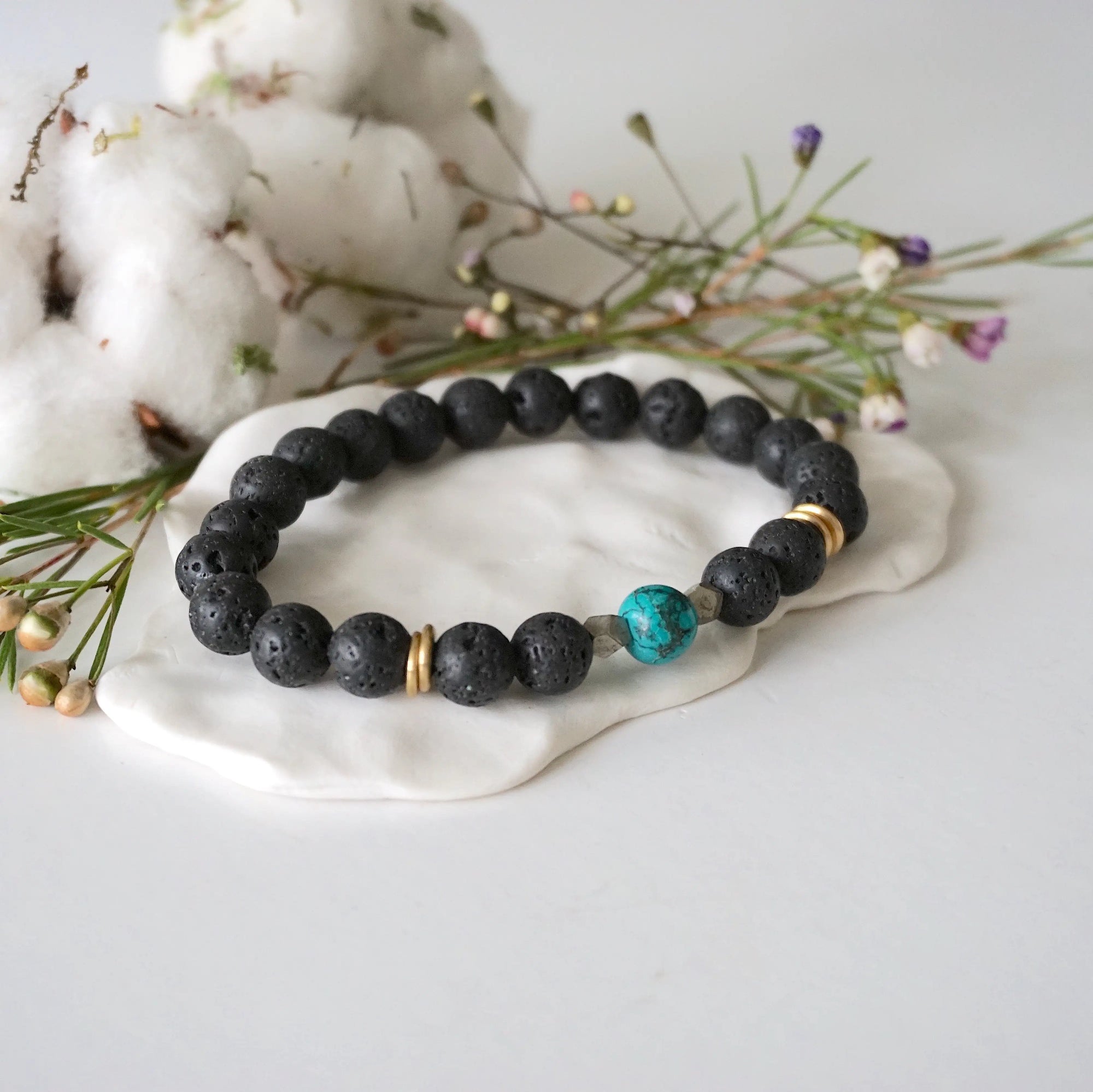 Turquoise lava bead mala bracelet with pyrite side view showing gold disks