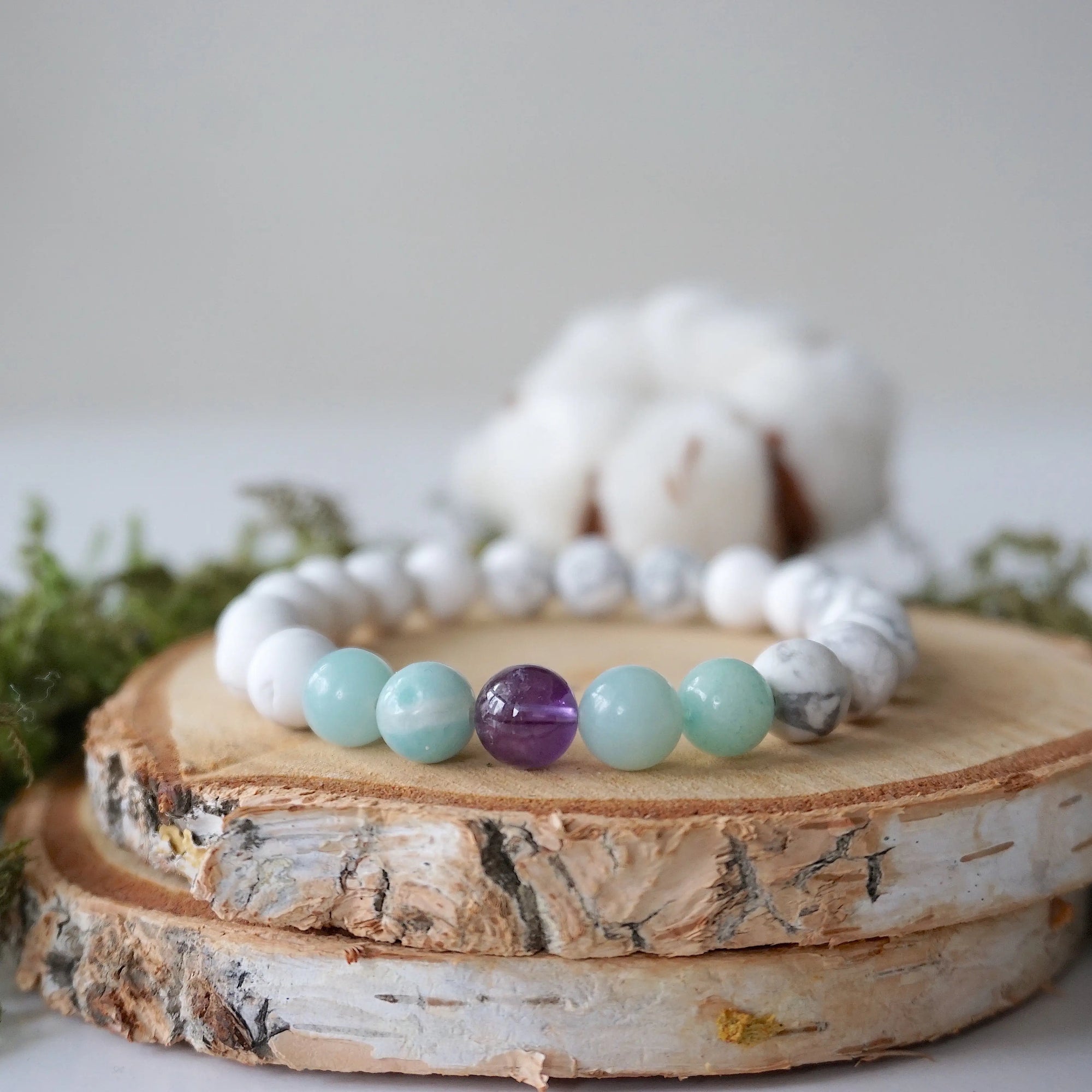 Detailed view of white howlite, amethyst, and amazonite stretch bracelet with 8mm crystal beads, calming gemstone jewelry