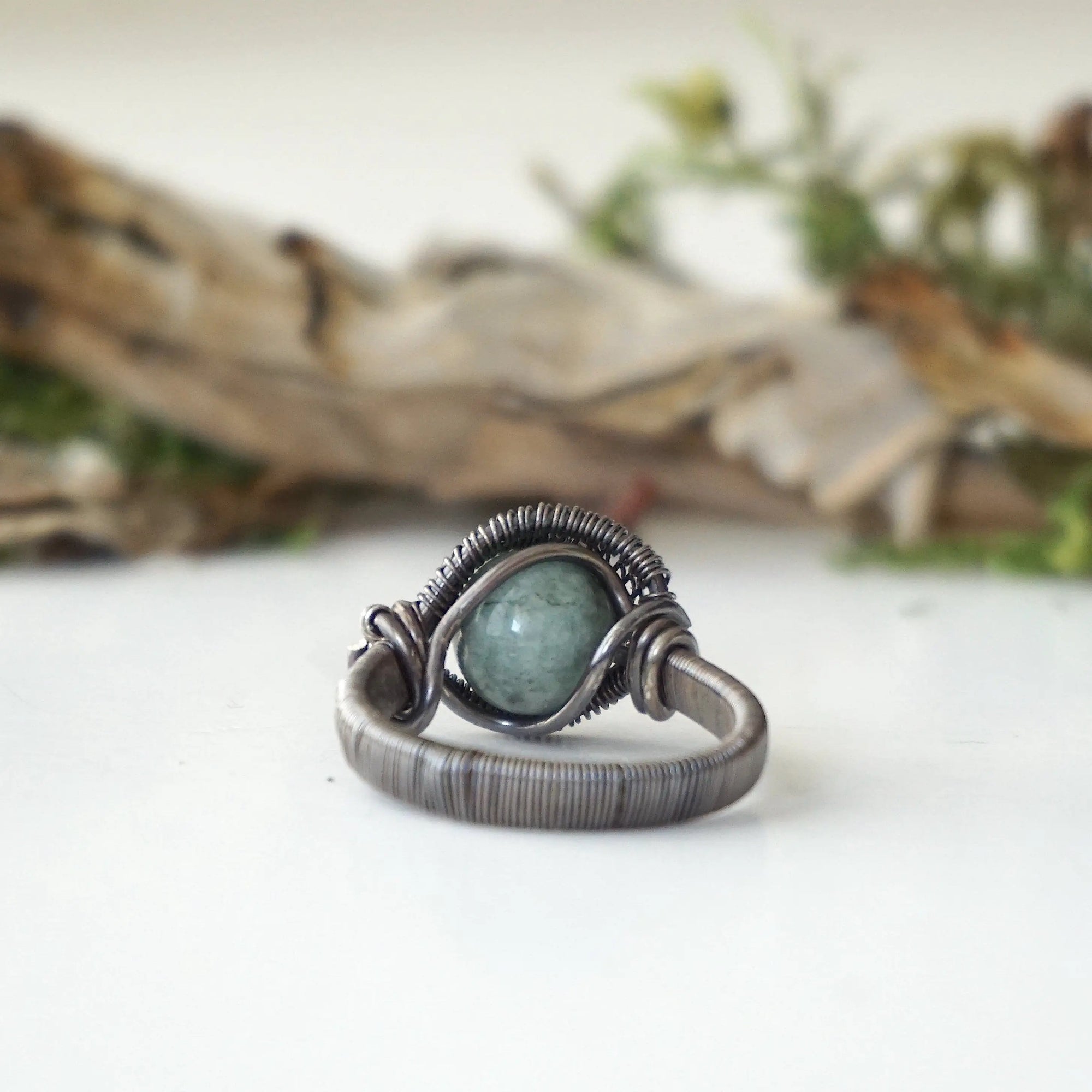 Back view of antiqued sterling silver emerald ring band showing handcrafted structure and ring design
