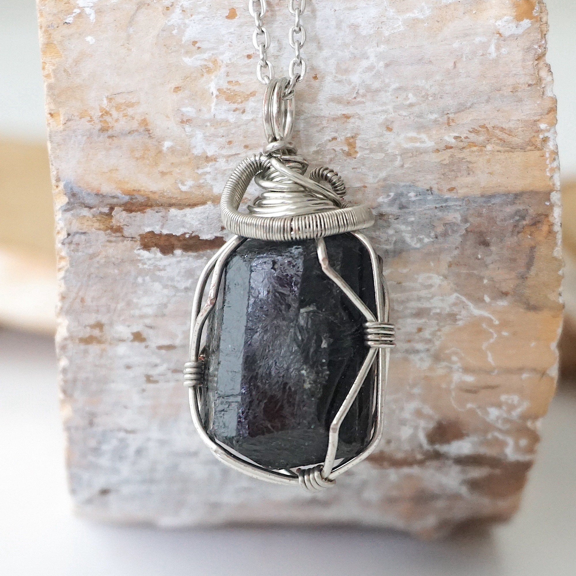 Handcrafted raw black tourmaline necklace for men, front view – artisan dark silver copper wire wrapping, natural October birthstone pendant.