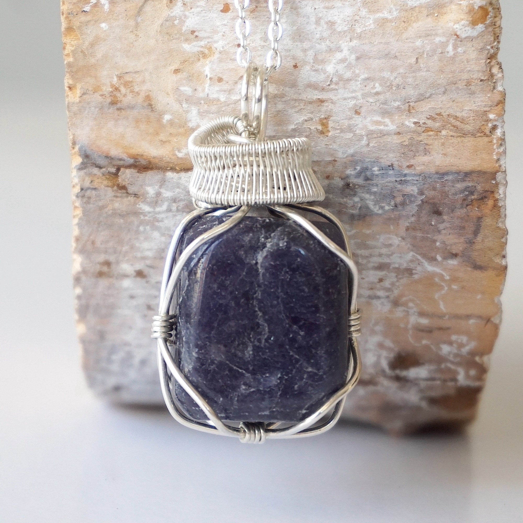 Handcrafted sapphire necklace for men, front view – artisan 925 sterling silver wire wrapping, genuine blue crystal pendant, September birthstone.
