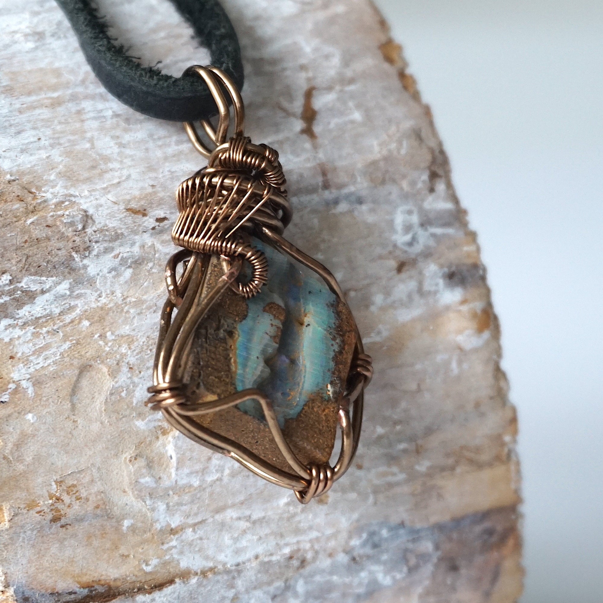 Right angle detail of Australian boulder opal necklace for men – close-up of artisan wire wrapping and unique opal pattern.