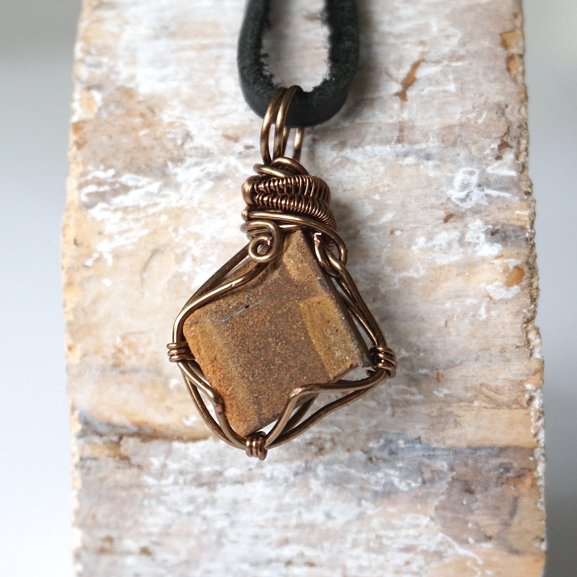 Back angle view of Australian boulder opal necklace for men – showcases wire wrapping and natural opal matrix.