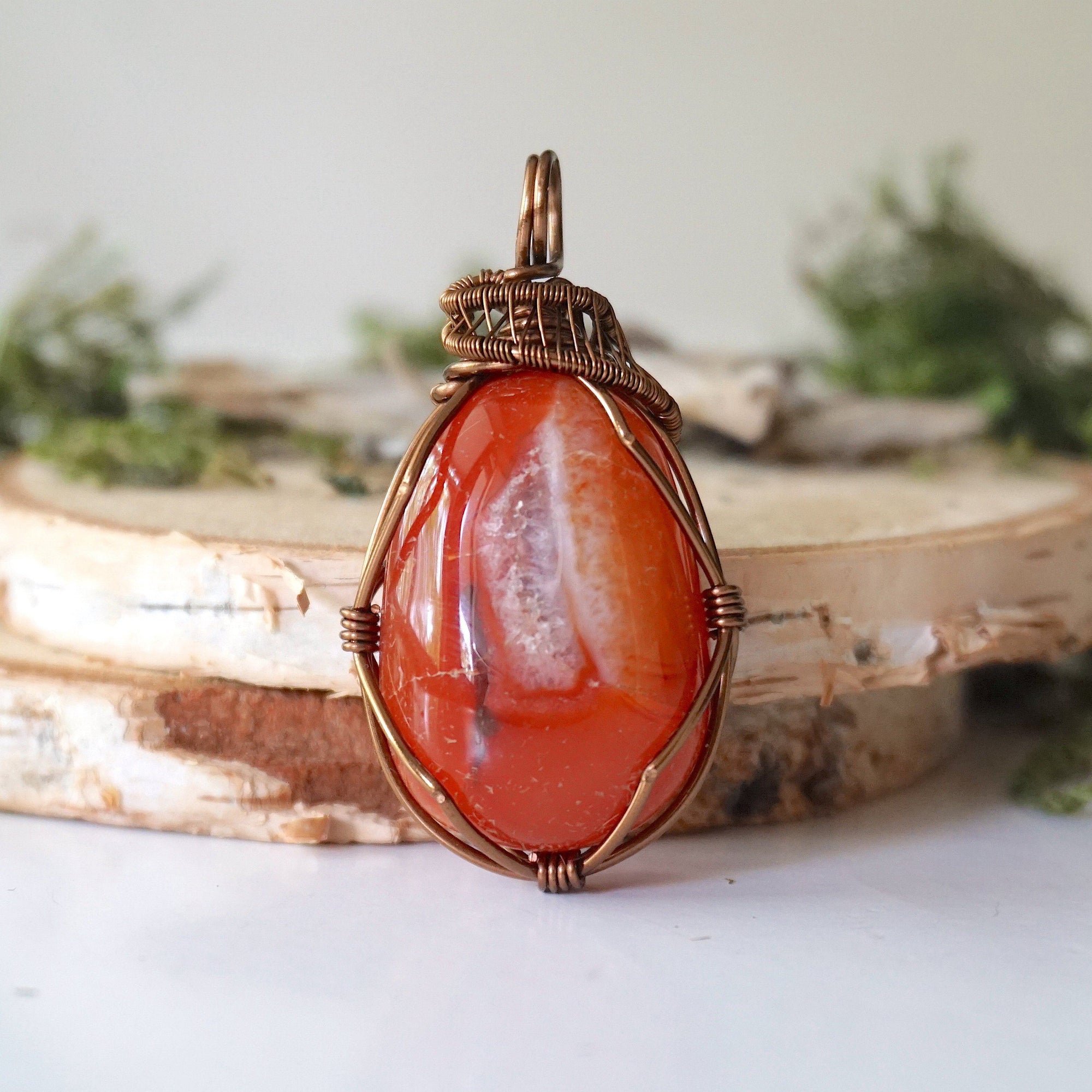 Front angle close-up of carnelian necklace – detailed artisan wire wrapping, natural raw carnelian, handcrafted Virgo birthstone pendant.