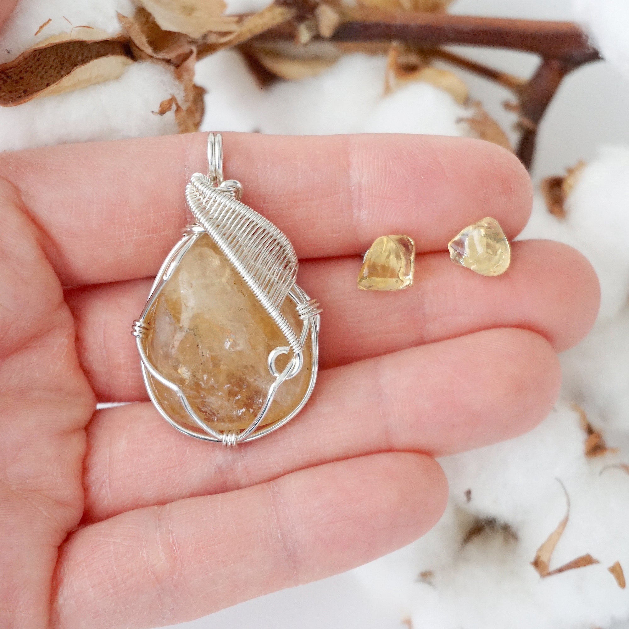 Citrine jewelry set held in hand showing size of wire wrapped necklace and stud earrings - handmade crystal gift set
