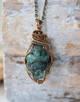 Handcrafted raw emerald necklace front view – artisan bronze and silver copper wire wrapping, May birthstone jewelry for all genders, Designs by Nature Gems.