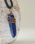 Right angle close-up of lapis lazuli point necklace for men – detailed antique bronze copper wire wrapping, natural lapis lazuli crystal.