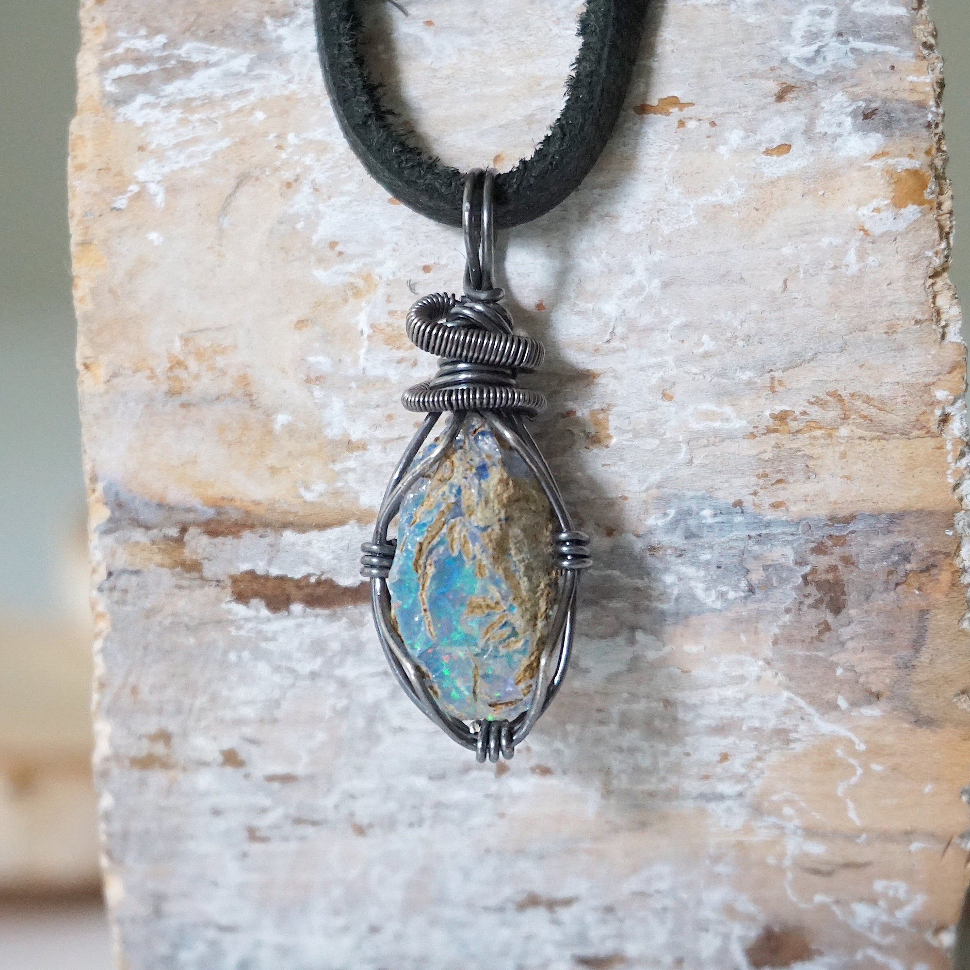 Handcrafted raw opal necklace for men, front view – artisan antiqued 925 sterling silver wire wrapping, October birthstone, black leather cord.