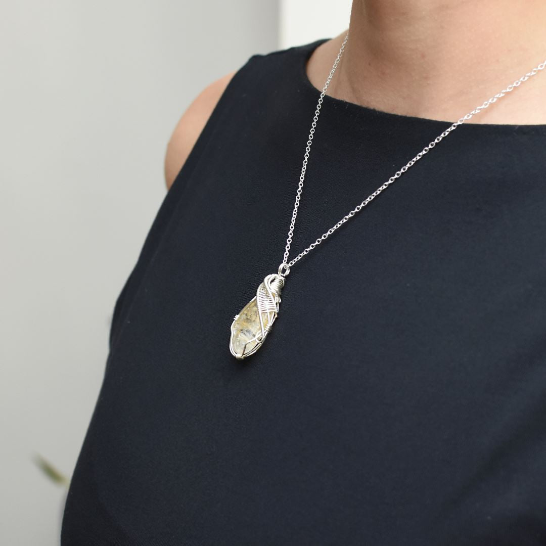 Woman wearing wire wrapped citrine necklace November birthstone pendant sterling silver jewelry
