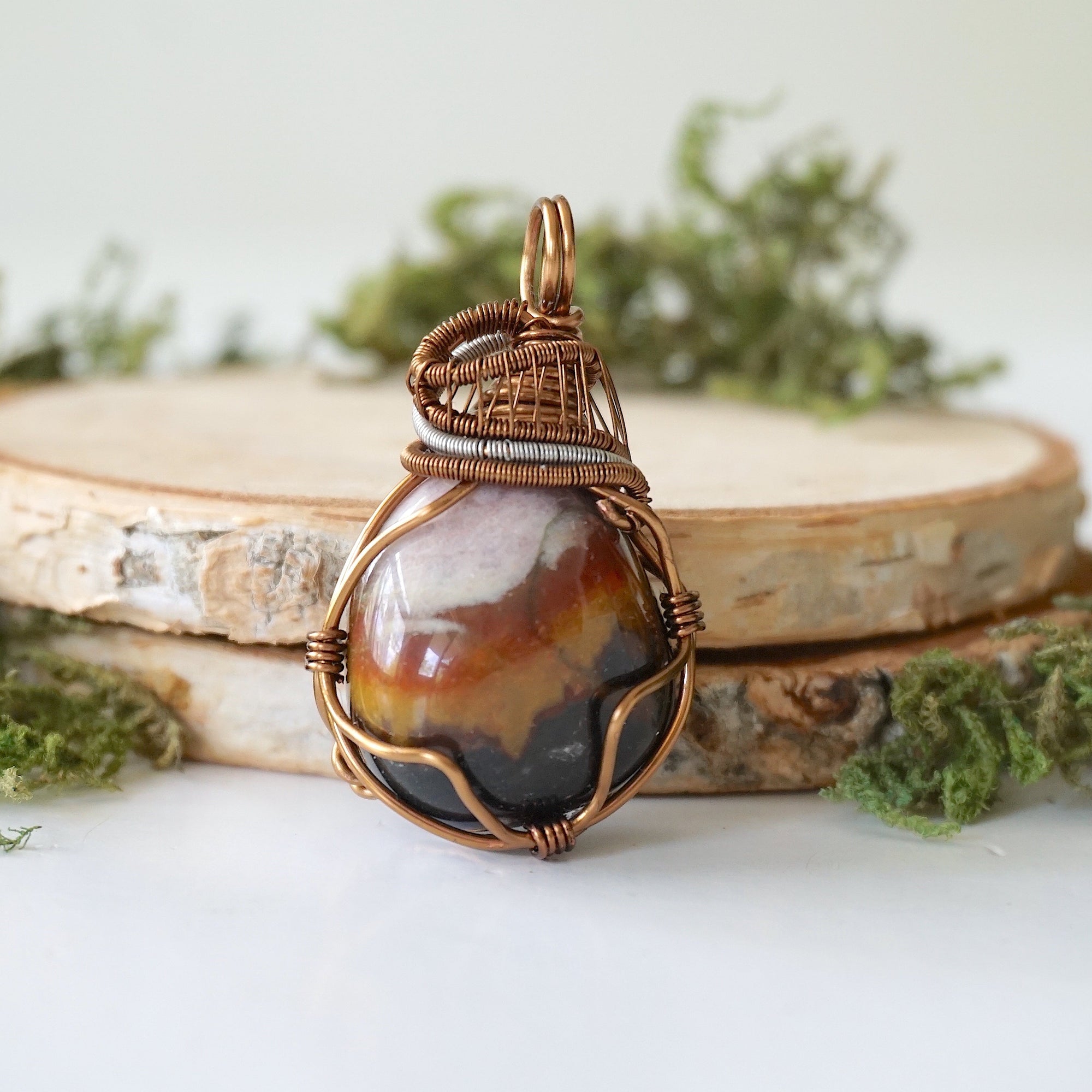 Front angle close-up of sardonyx necklace – detailed artisan wire wrapping, natural banded sardonyx, handcrafted August birthstone pendant.