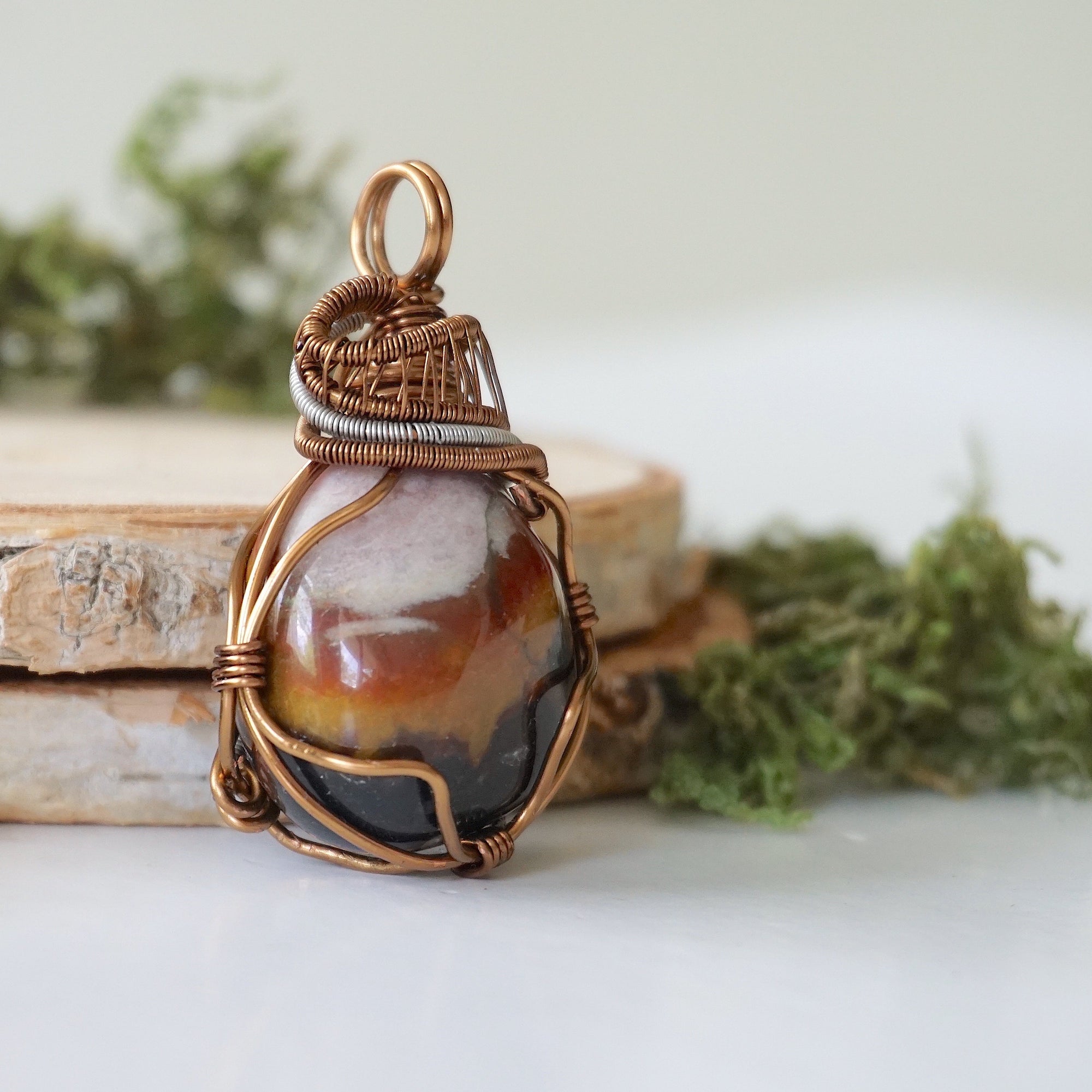 Right angle close-up of sardonyx necklace – highlighting unique wire-wrapped artistry, raw sardonyx crystal, gender-inclusive jewelry.