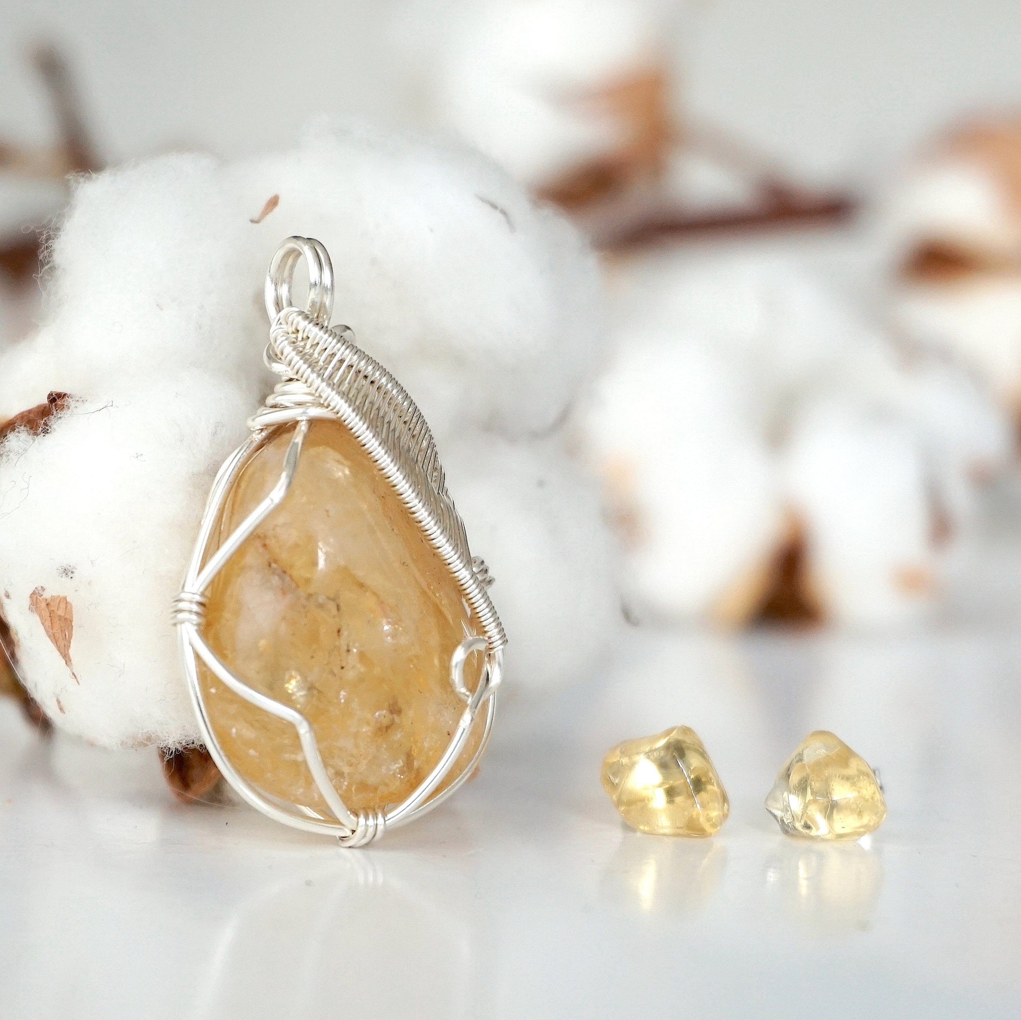 Side view of raw citrine necklace and earrings set showing wire wrapping detail and natural stone texture
