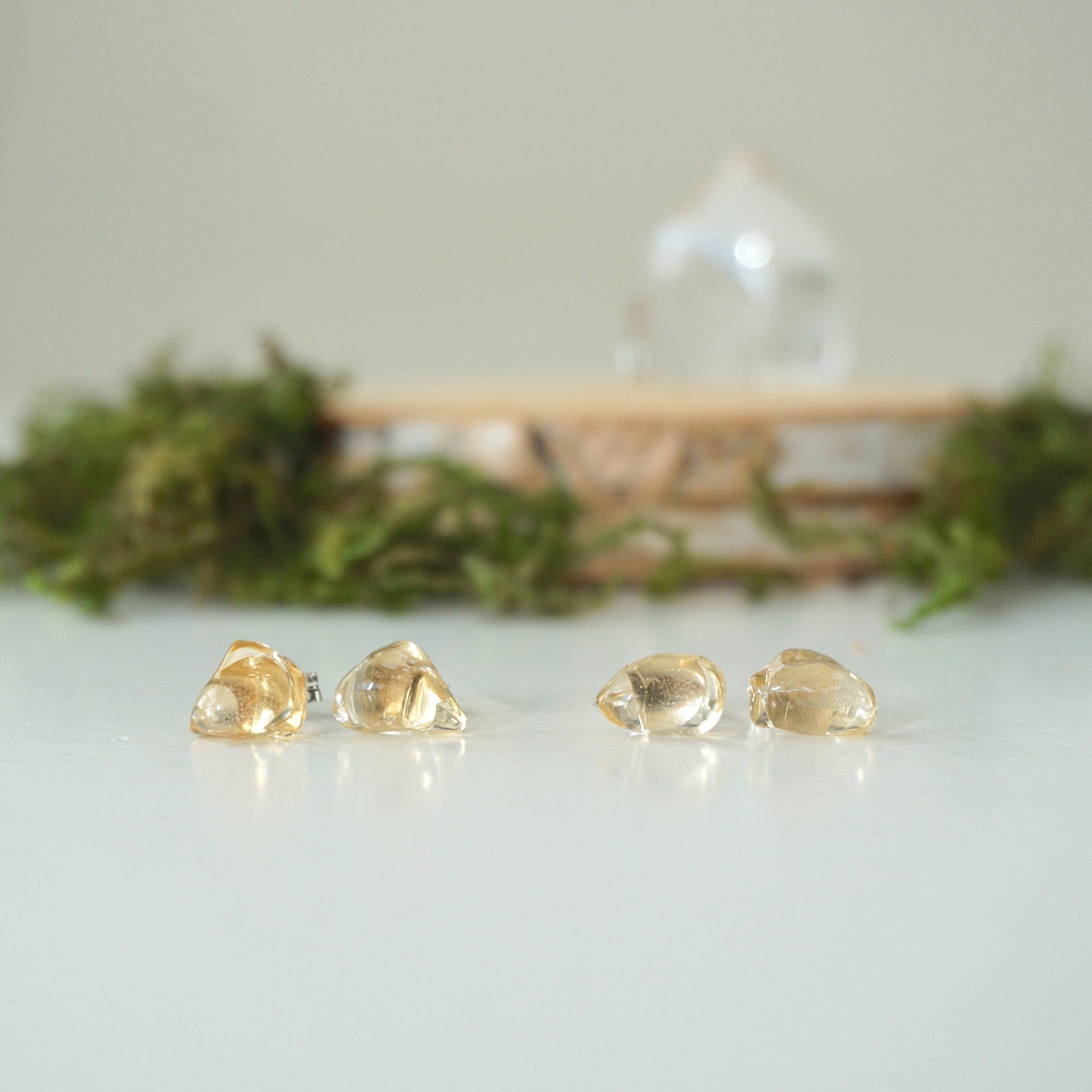Two pairs of raw citrine stud earrings showing natural stone variation and size options - handmade crystal jewelry
