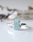 Detailed front angle of adjustable aquamarine ring, raw aquamarine, 925 sterling silver prong setting