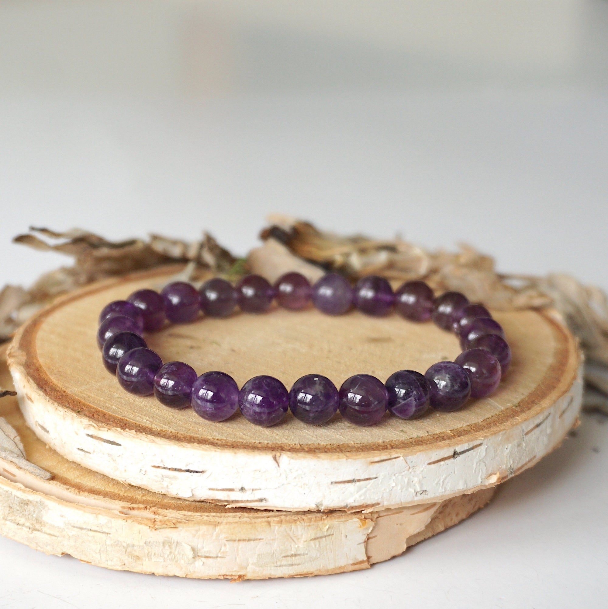 Detailed view of amethyst beaded stretch bracelet, natural 8mm amethyst beads, unisex design