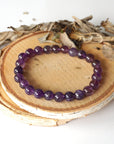 Top view of amethyst beaded stretch bracelet, natural 8mm amethyst beads, unisex design
