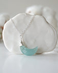 Detailed front view of aquamarine moon necklace for women, minimalist artisan wire wrapping in sterling silver, Designs by Nature Gems