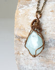 Left angle detail of genuine aquamarine necklace, artisan wire wrapped pendant by Designs by Nature Gems.